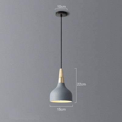 Gray pendant light with wooden accents and black cord, modern design.