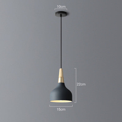 Black and gold pendant light with a conical shade, minimalist design.