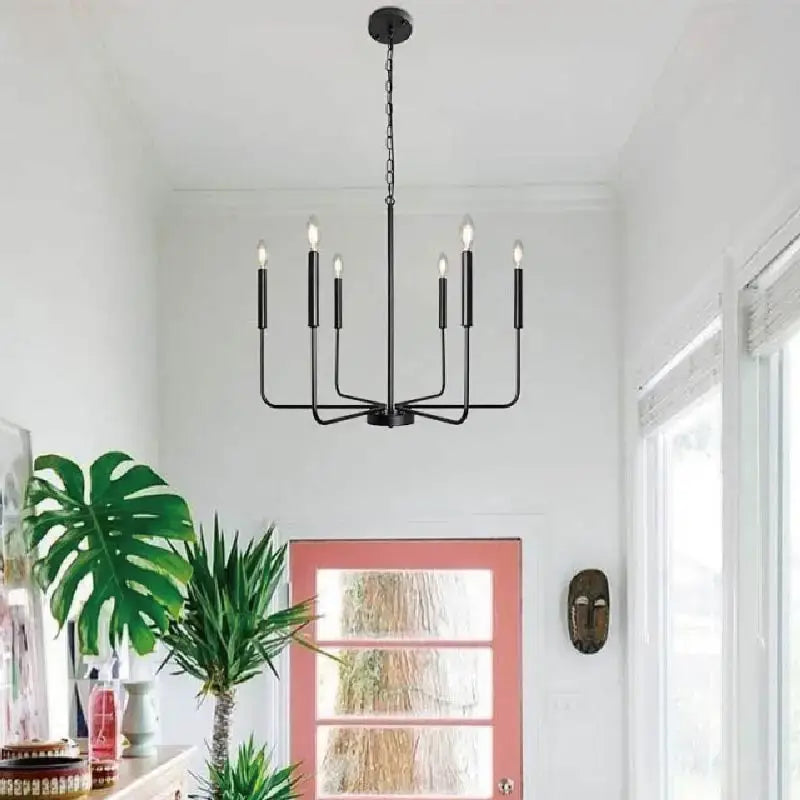 Distressed silver iron candle chandelier with six candle-style bulbs for dining room decor by decorbites iron candle