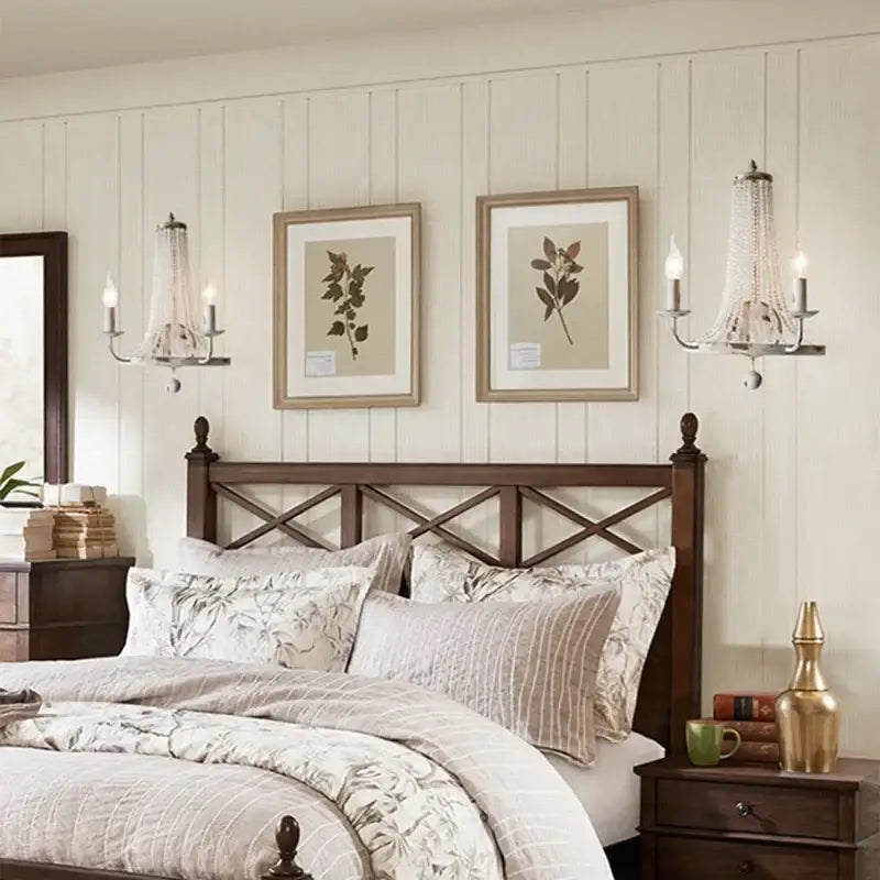Dark wood headboard with crisscross lattice design paired with distressed white crystal tassel wall lamp decorbites crystal tassel