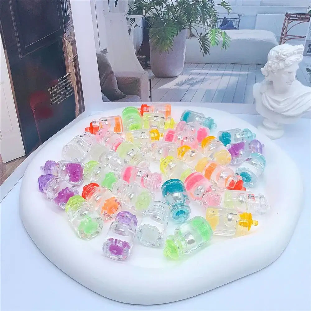 A collection of colorful translucent plastic diy heart pearl shell miniature wishing bottles with vibrant caps for decorbites heart pearl bedroom decor accessory
