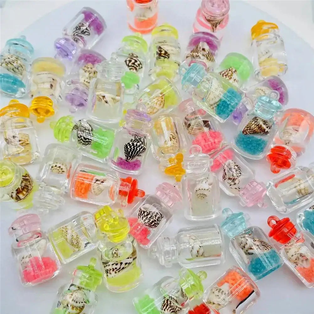 Colorful diy heart pearl shell miniature wishing bottles with clear lids containing tiny seashells and vibrant beads decorbites heart pearl