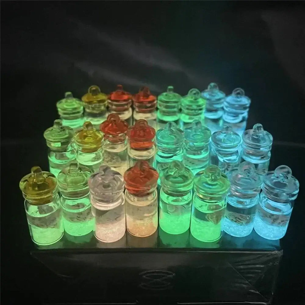 A collection of clear glass diy heart pearl shell miniature wishing bottles with colorful glowing liquids and matching caps for decorbites heart pearl bedroom decor