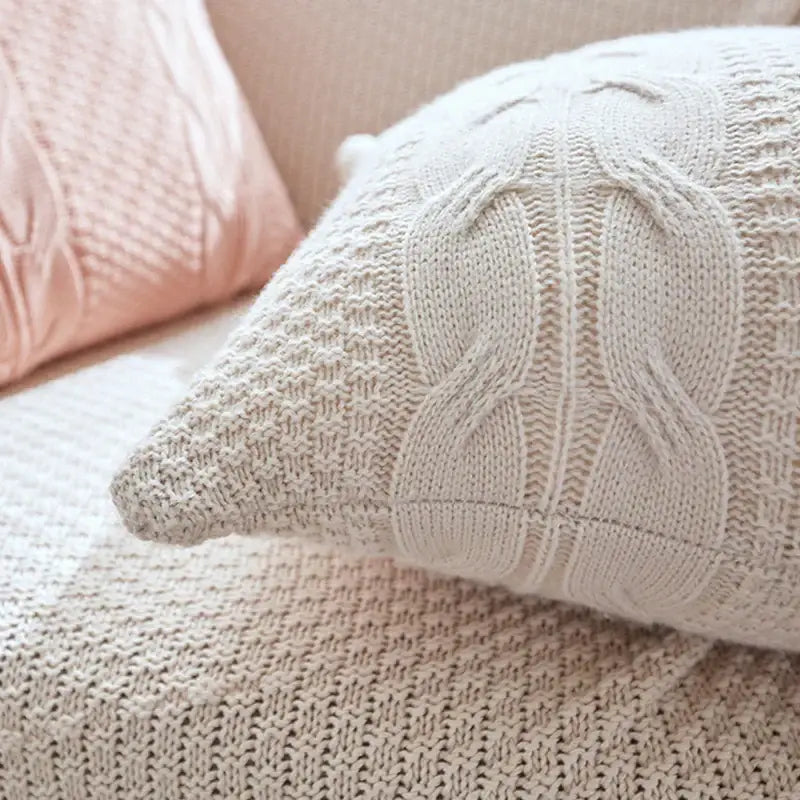 Cream-colored double cable knit cushion cover set featuring a cable knit cushion pattern for living room decor