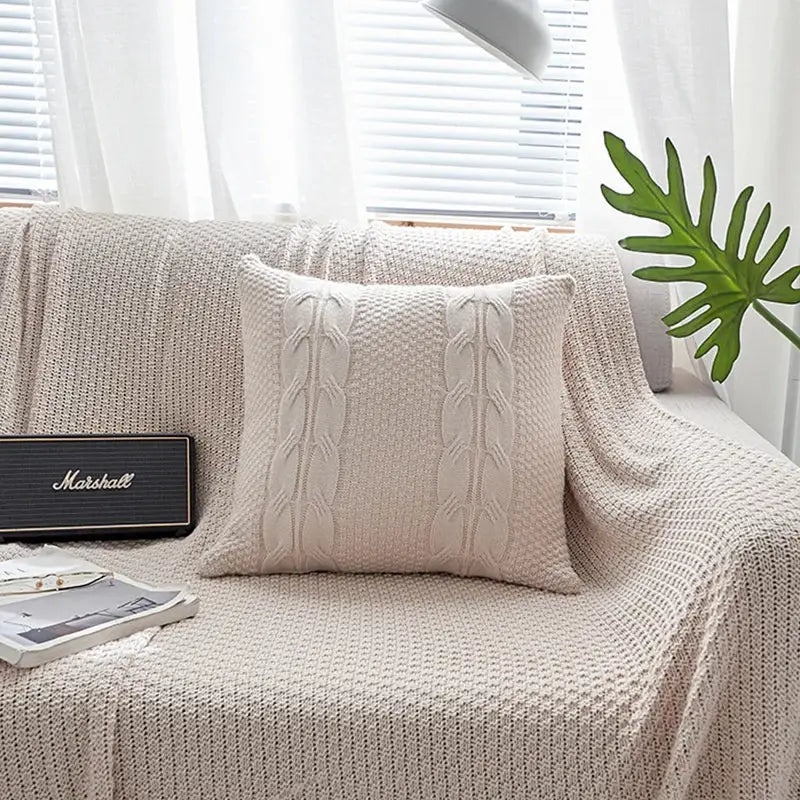 Cream-colored double cable knit cushion cover set featuring textured cable knit throw pillow for living room