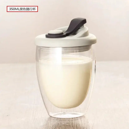 350ml black travel mug with clear double-walled glass body and gray lid with black flip-top seal double deck insulated design