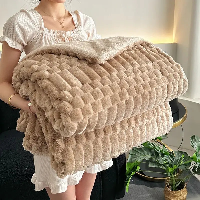 A beige double layer lamb plush throw blanket with a soft textured fleece and ribbed plush throw blanket pattern