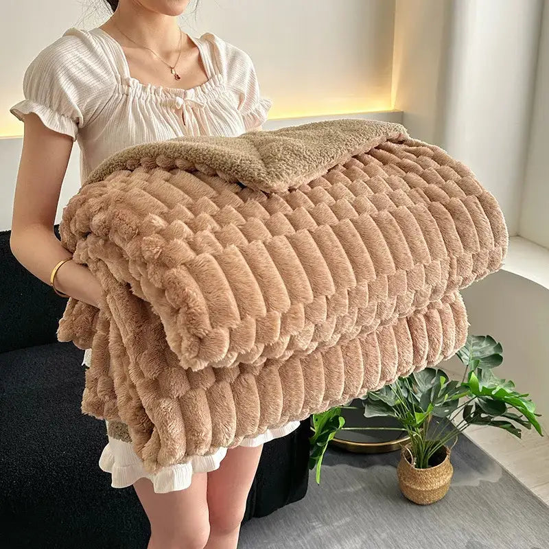 A tan double layer lamb plush throw blanket with textured ribbed fleece offers soft and cozy warmth