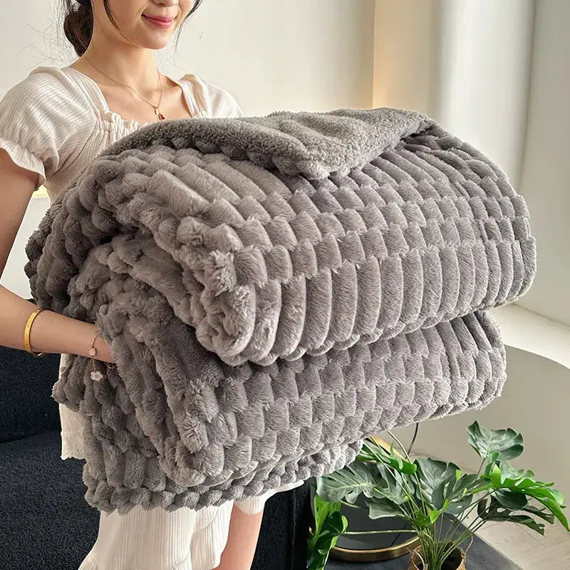 A cozy gray double layer lamb plush throw blanket with textured fleece and chunky knit pattern for bedroom use
