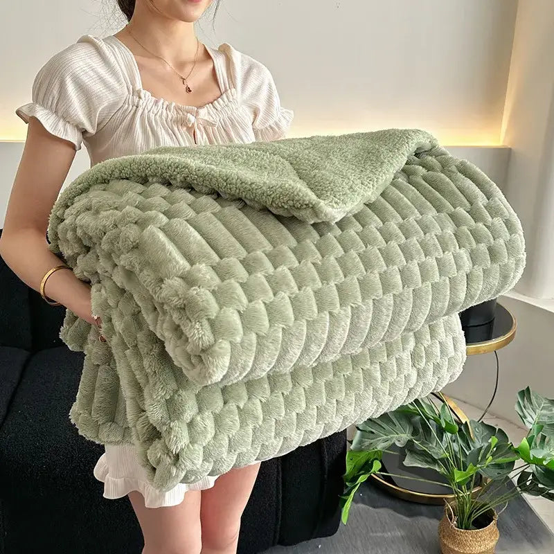 A soft mint-green double layer lamb plush throw blanket with textured quilted plush fleece surface for bedroom use
