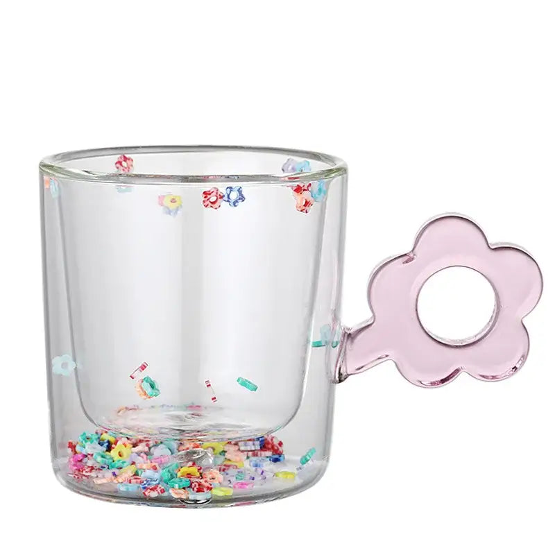 Double wall glass mug with pink flower-shaped handle and colorful glitter flowers for kitchen and dining room use