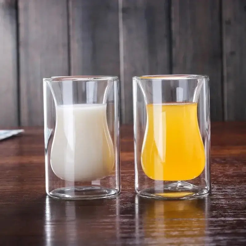 Clear double walled glass mug with curved tulip shape from a drinkware collection enhances the drinking experience