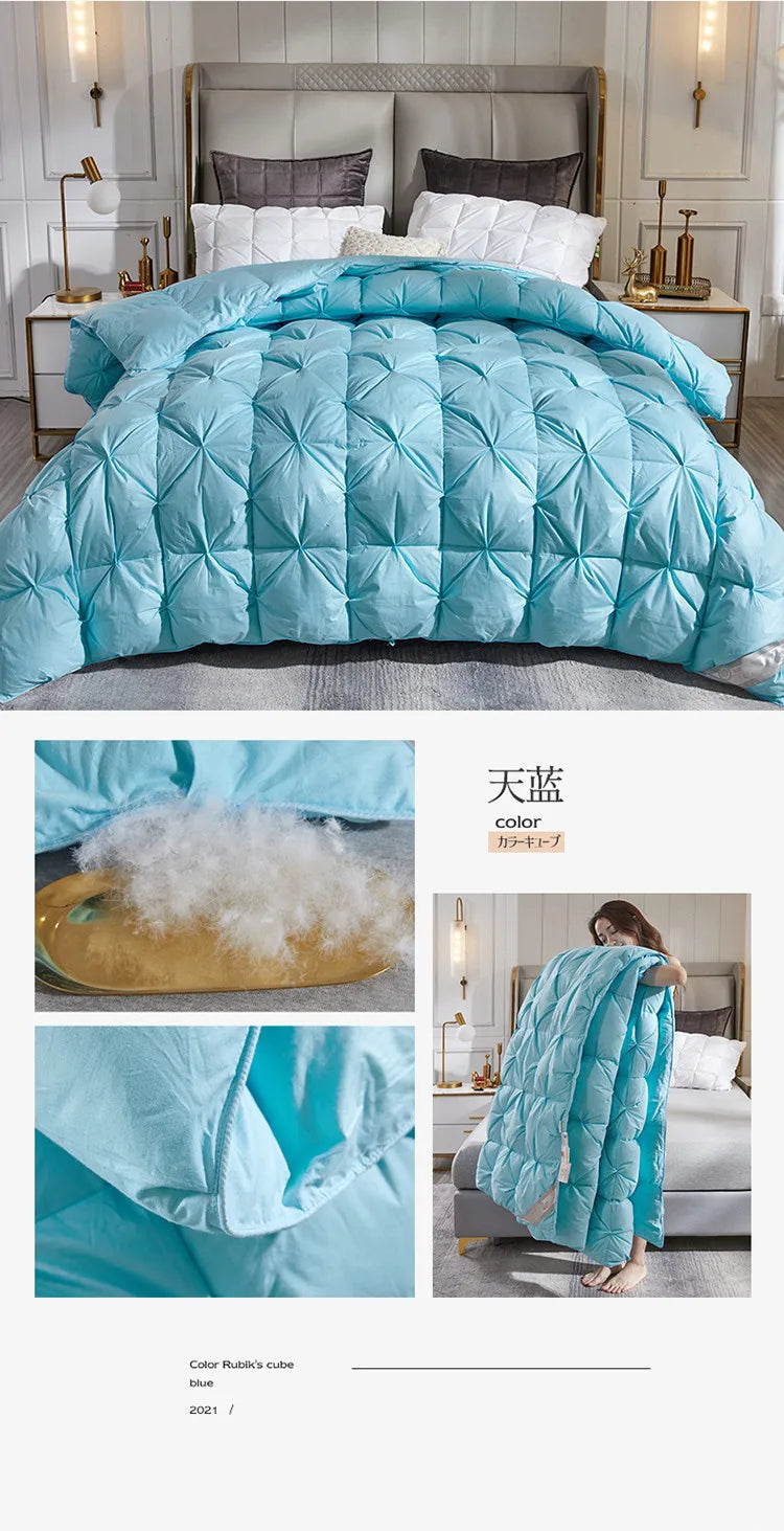 A plush light blue quilted down duvet with 95 white goose down filling and a diamond-patterned exterior for warm comfort