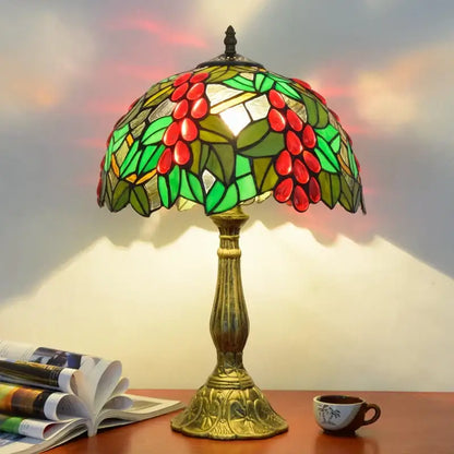 Vibrant decorbites dragonfly tiffany stained glass table lamp with red coffee beans, green leaves, and ornate brass base