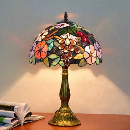 Dragonfly tiffany stained glass table lamp with floral grapevine design and multicolored panels on brass base