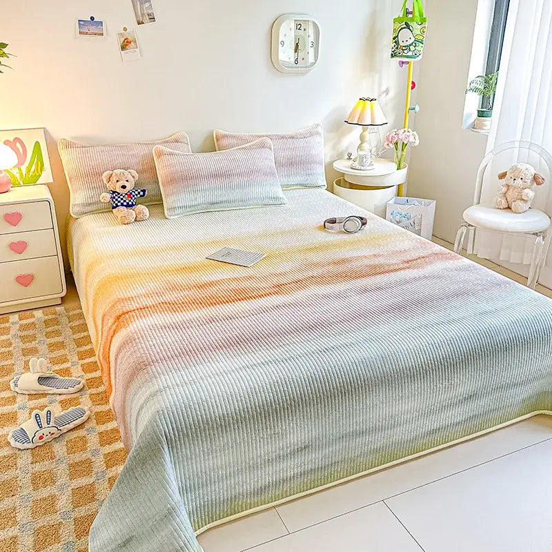 Pastel rainbow gradient corduroy bedspread with ribbed texture and soft peach to mint green colors for decorbites dreamy gradient