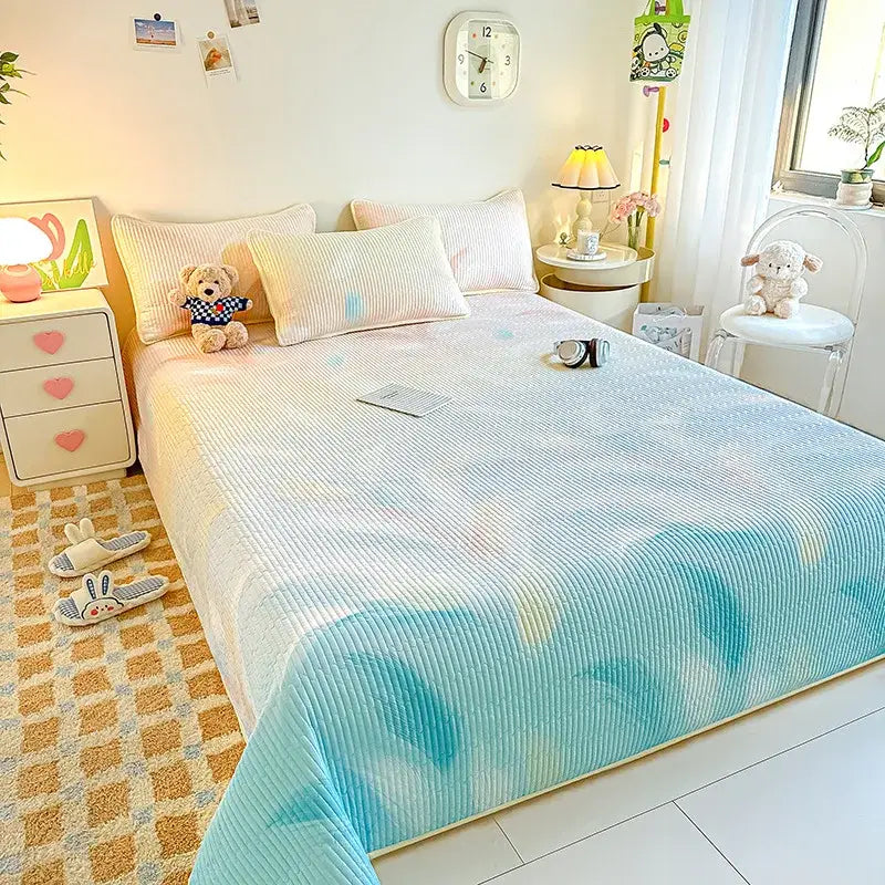 Pastel blue and white corduroy quilted dreamy gradient single bedspread with a soft textured surface for bedroom decor