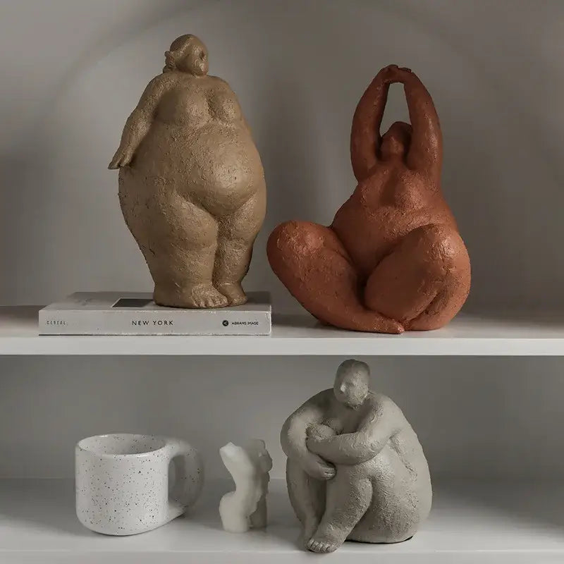 Two terracotta textured ceramic dreaming yoga women figurines in relaxed poses for living room decorbites decorbites dreaming yoga