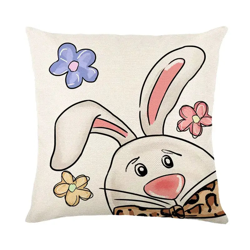 Beige linen cushion cover featuring an easter bunny rabbit with pink ears and embroidered floral accents