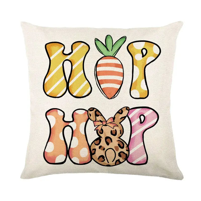 Cream-colored linen cushion cover featuring easter bunny rabbit design with hop hop text and floral bunny accents