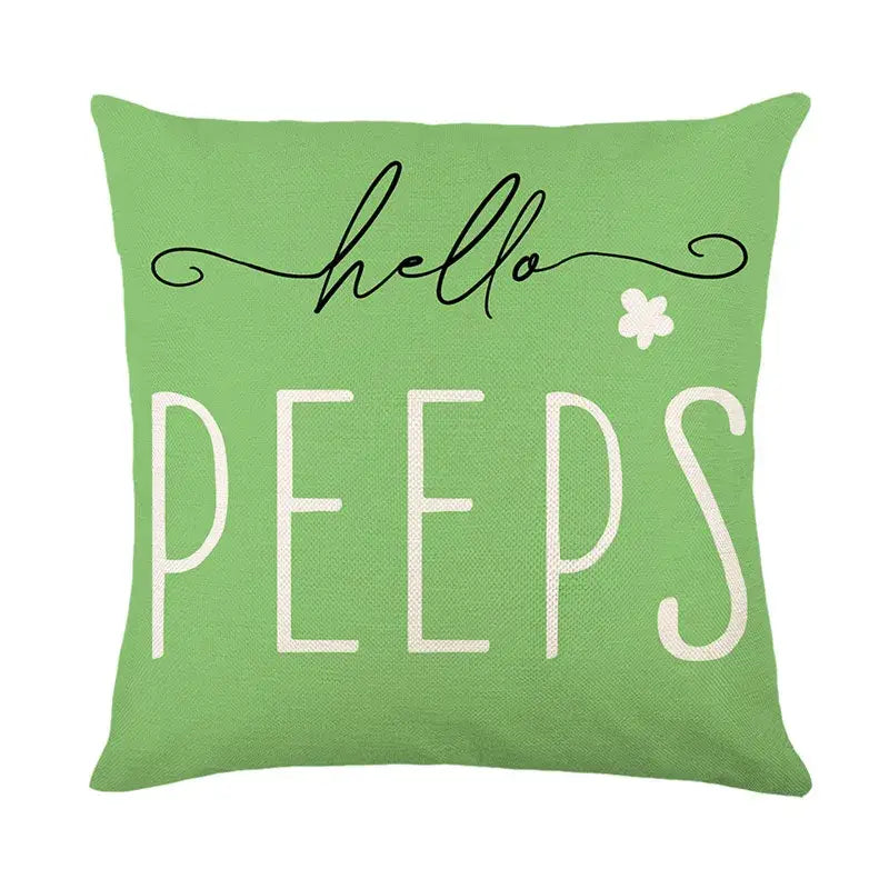 A light green bunny rabbit linen cushion cover with hello peeps text and a white shamrock for living room decor