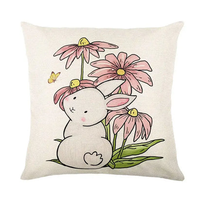 A soft beige linen cushion cover featuring an easter bunny rabbit among pink coneflowers and a yellow butterfly