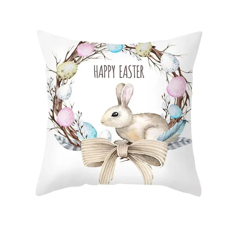 White throw pillow with a watercolor easter rabbit nestled in a wreath on an eggs pillowcase for home decor
