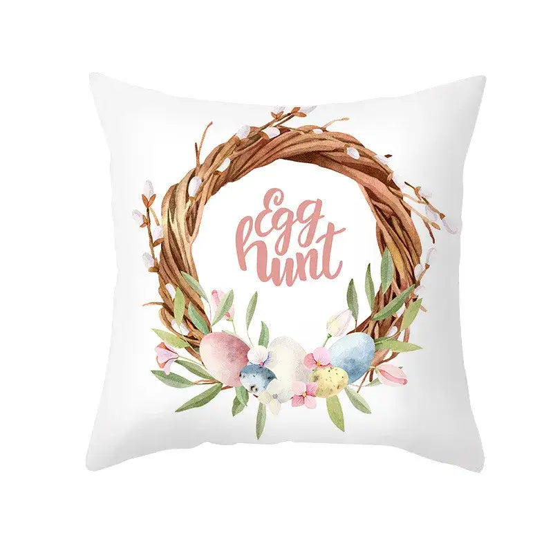 White throw pillow with easter rabbit watercolor wreath featuring pastel eggs greenery and egg hunt text for home decor