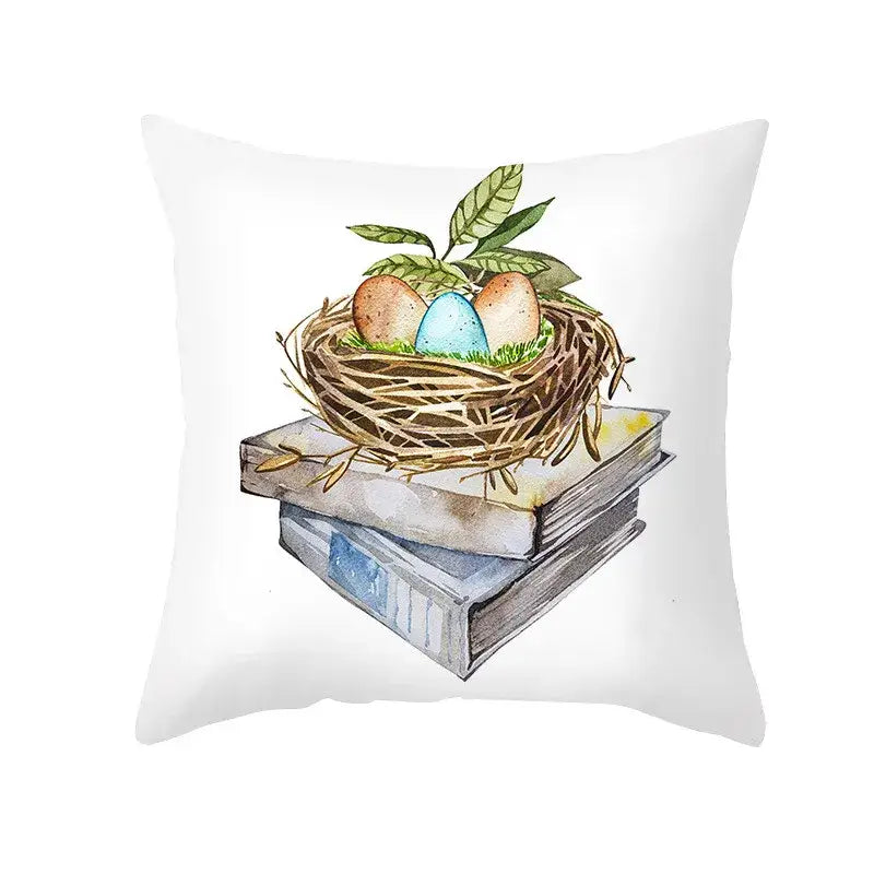 White throw pillow featuring a watercolor bird’s nest with eggs on books and leaves for easter rabbit eggs pillowcase home decor