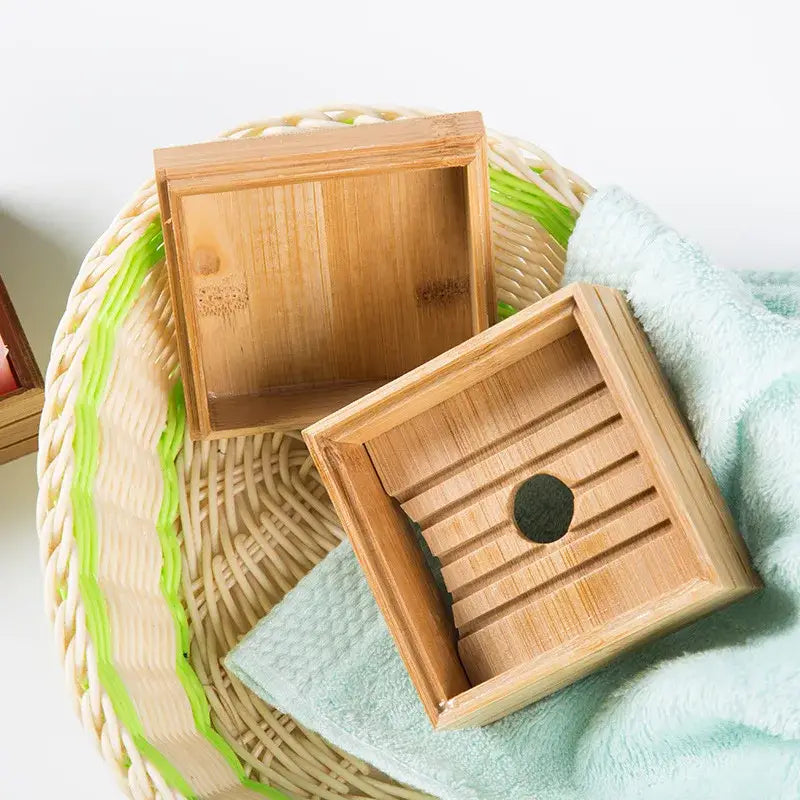 Eco-friendly light brown bamboo soap dish with slatted design and circular cutout for bathroom storage use