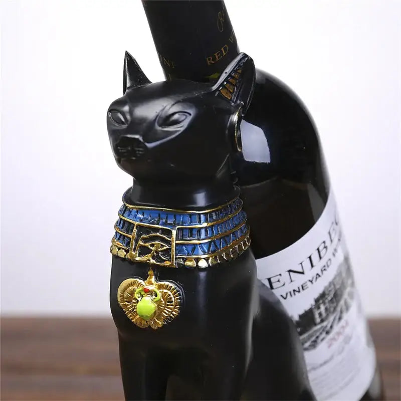 Black resin cat figurine with gold and blue collar featuring eye pendant for egyptian black and gold god wine rack decor