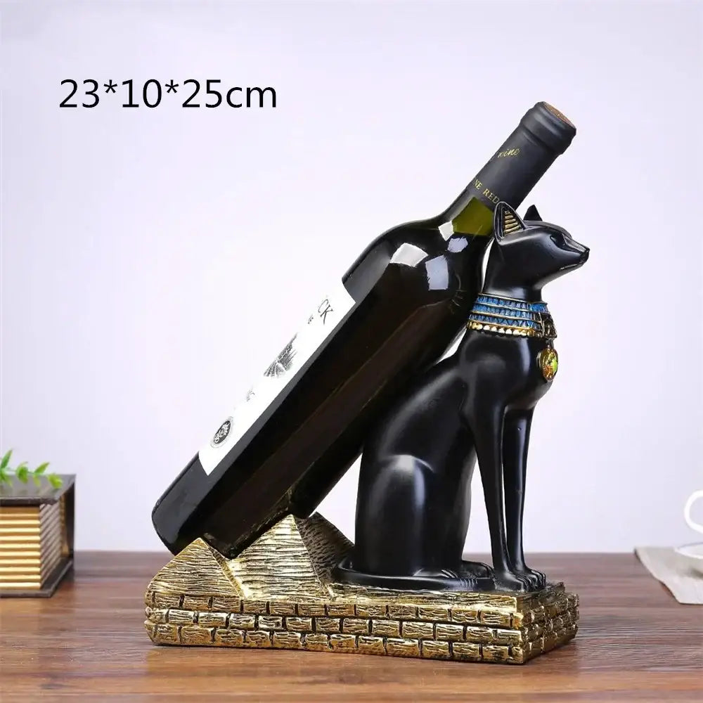Black resin egyptian cat wine bottle holder with blue and gold collar on golden brick base for dining room decor