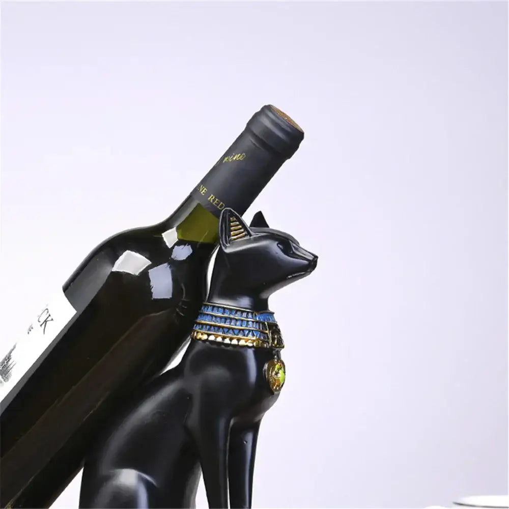 Black egyptian cat wine bottle holder with blue and gold ornate collar for elegant dining room decor