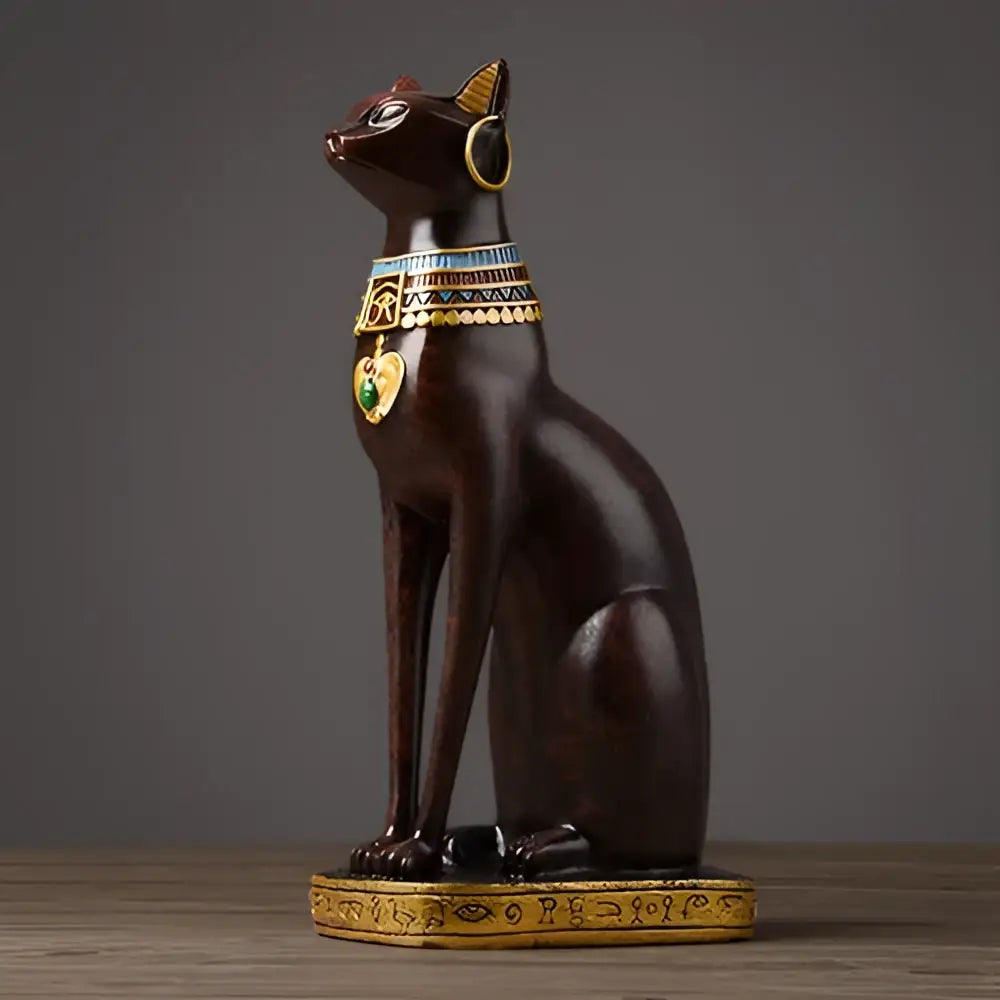 Dark brown egyptian cat resin figurine with gold and green accents and hieroglyphic base for home decor