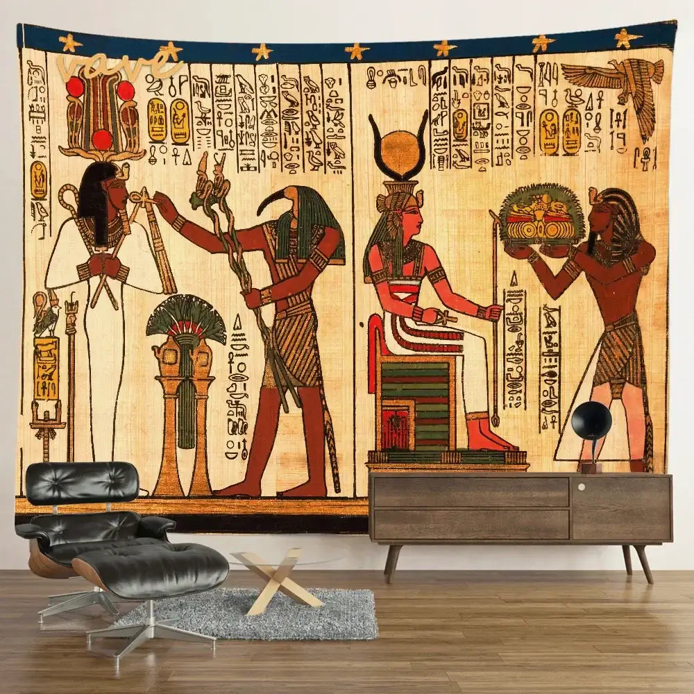 Egyptian mandala tapestry wall hanging in blue and gold featuring hieroglyphics displayed above modern furniture