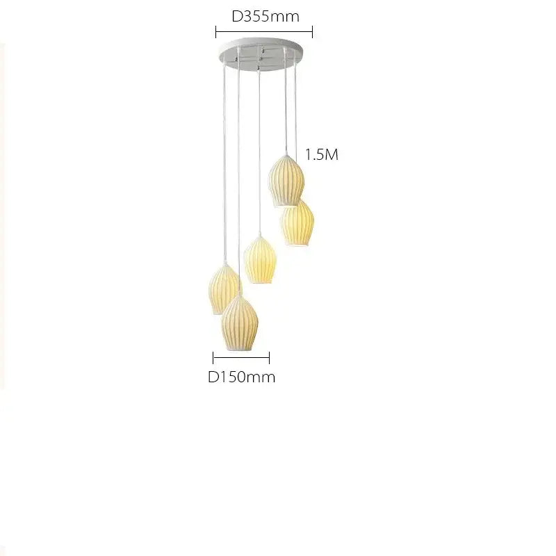 Modern pendant lights with five warm-toned ribbed ceramic shades in white and gold for dining room elegance ribbed ceramic pendant