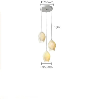 Modern white and gold elegance ribbed ceramic pendant lights with three vertically aligned lampshades for dining room