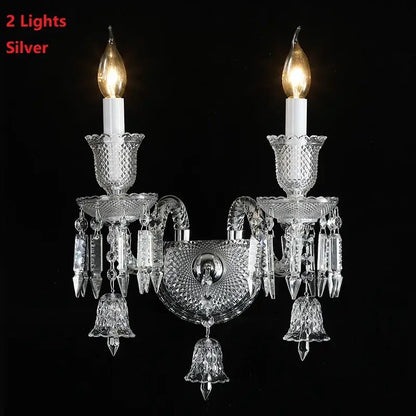 Silver two-light decorbites crystal wall lamp with intricate cut glass and dangling bell-shaped ornaments for elegant decor