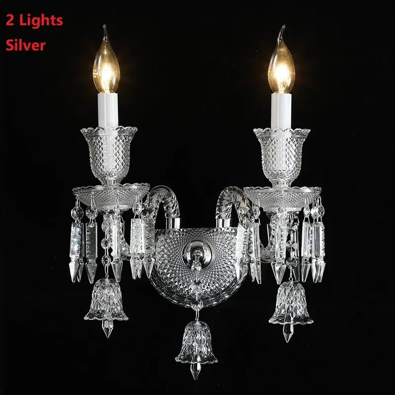 Silver two-light decorbites crystal wall lamp with intricate cut glass and dangling bell-shaped ornaments for elegant decor