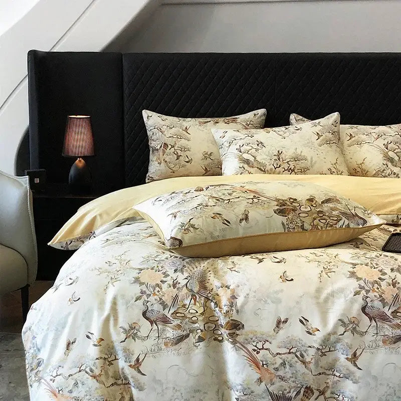 Cream-colored bedding set with intricate bird and floral patterns in muted earth tones made of colorful egyptian cotton