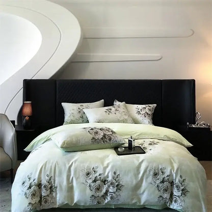 Light green satin duvet cover with black gray floral embroidery and matching pillows on black headboard in colorful egyptian cotton bedding set decorbites