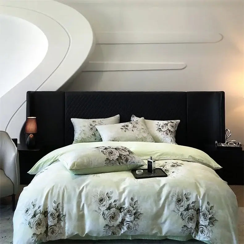 Light green satin duvet cover with black gray floral embroidery and matching pillows on black headboard in colorful egyptian cotton bedding set decorbites