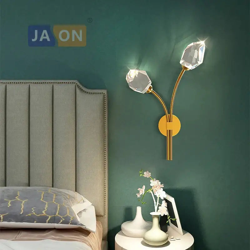 Elegant black and gold decorbites crystal stone wall sconce with gold-toned frame and two faceted crystal bulbs for bedroom decor