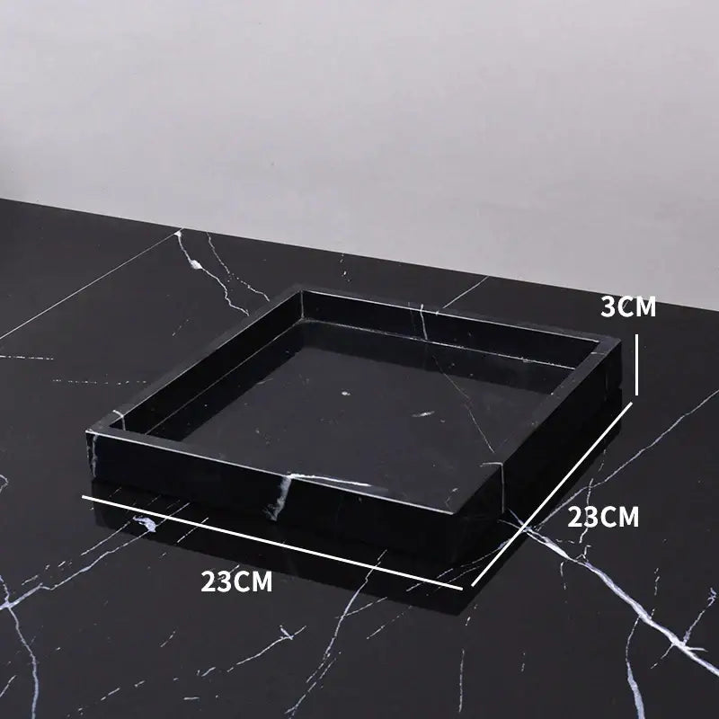 Elegant black and white afralia marble tray with glossy finish and subtle white veining for bedroom decor