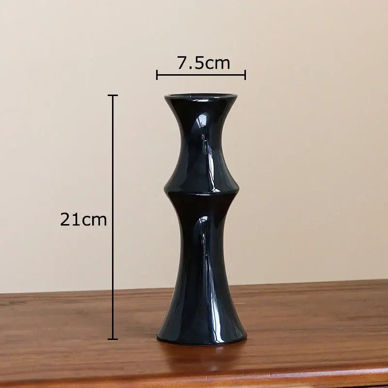 A sleek glossy black bamboo shape ceramic vase with a slender fluted design for living room table decorbites decor