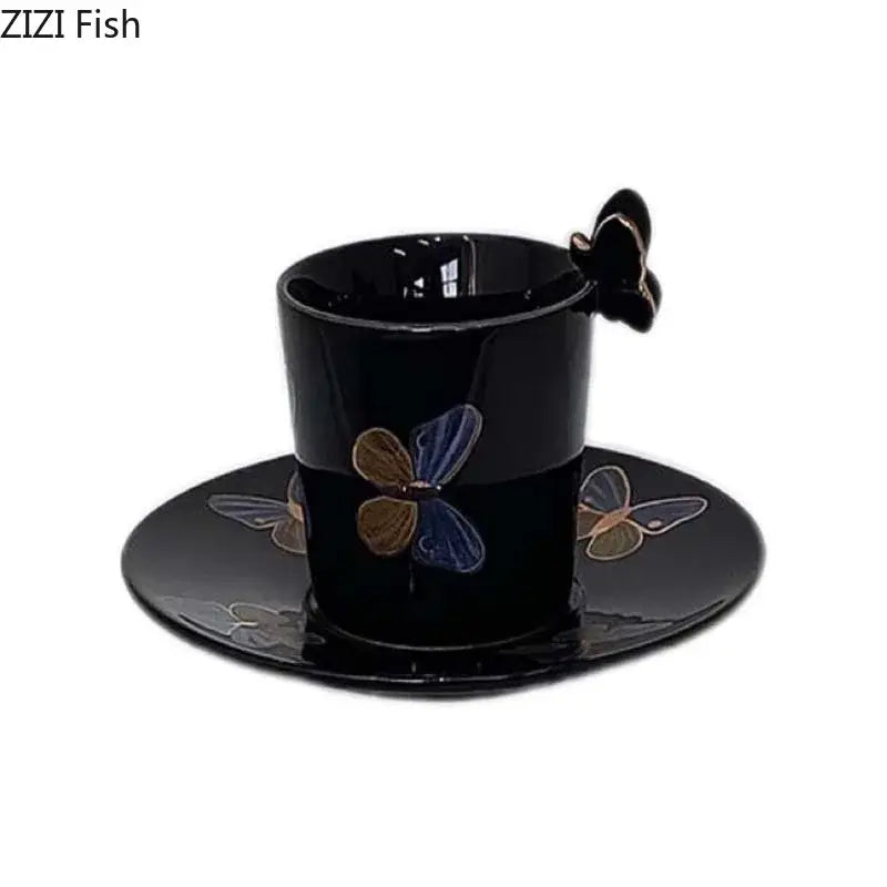 Elegant black ceramic tea cup and saucer set with blue gold and silver butterfly decals and matching butterfly handle
