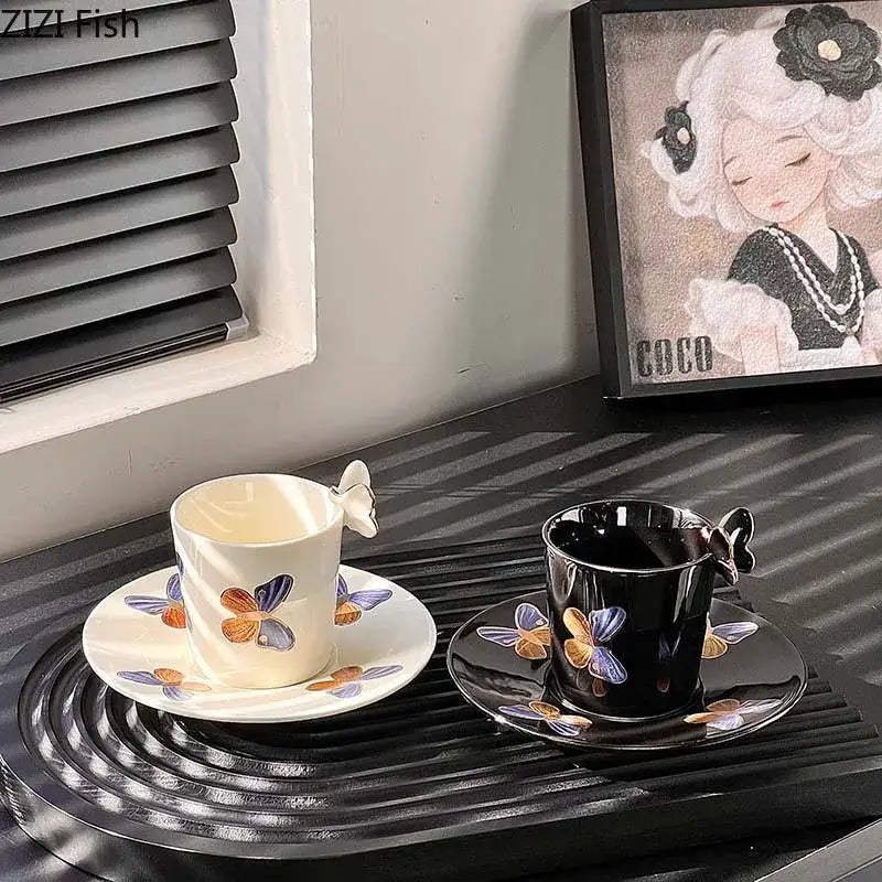 Elegant black butterfly ceramic tea cup and saucer set with cream butterfly handle and painted butterfly designs
