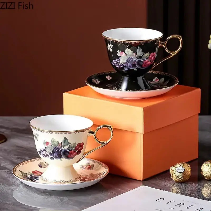 Elegant black and cream fruits pattern ceramic teacups with gold-trimmed handles for decorbites fruits pattern tea set