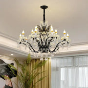 Elegant black wrought iron crystal candle chandelier lighting with sparkling droplets and candle-style bulbs for dining room decorbites