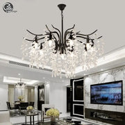 Elegant black crystal chandelier with cascade of clear crystal droplets in wrought iron for dining room lighting